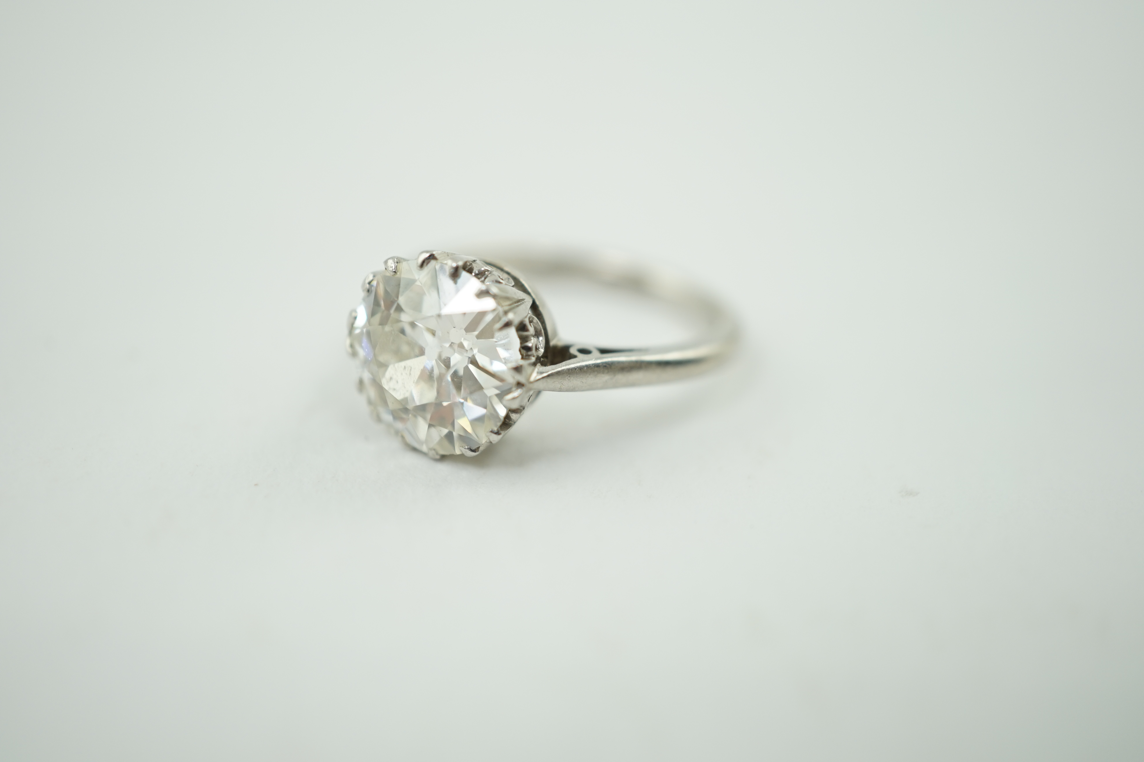 A platinum and solitaire diamond set ring